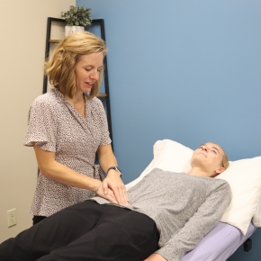 Sarah Rimpley performing assessment on pelvic floor therapy patient