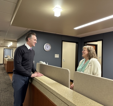 Dr. Mues and nurse Robin talking in the clinic